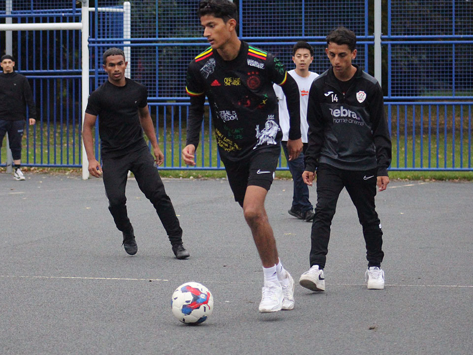 Young people taking part in a football tournament