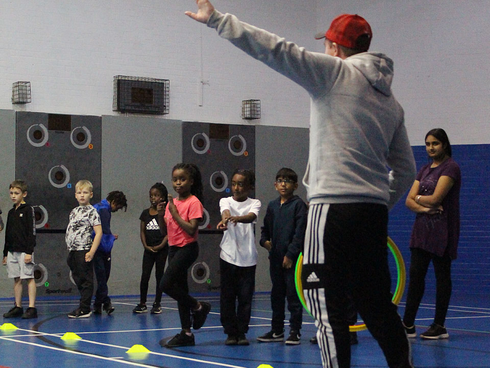 children taking part in a can youth sport fitness session